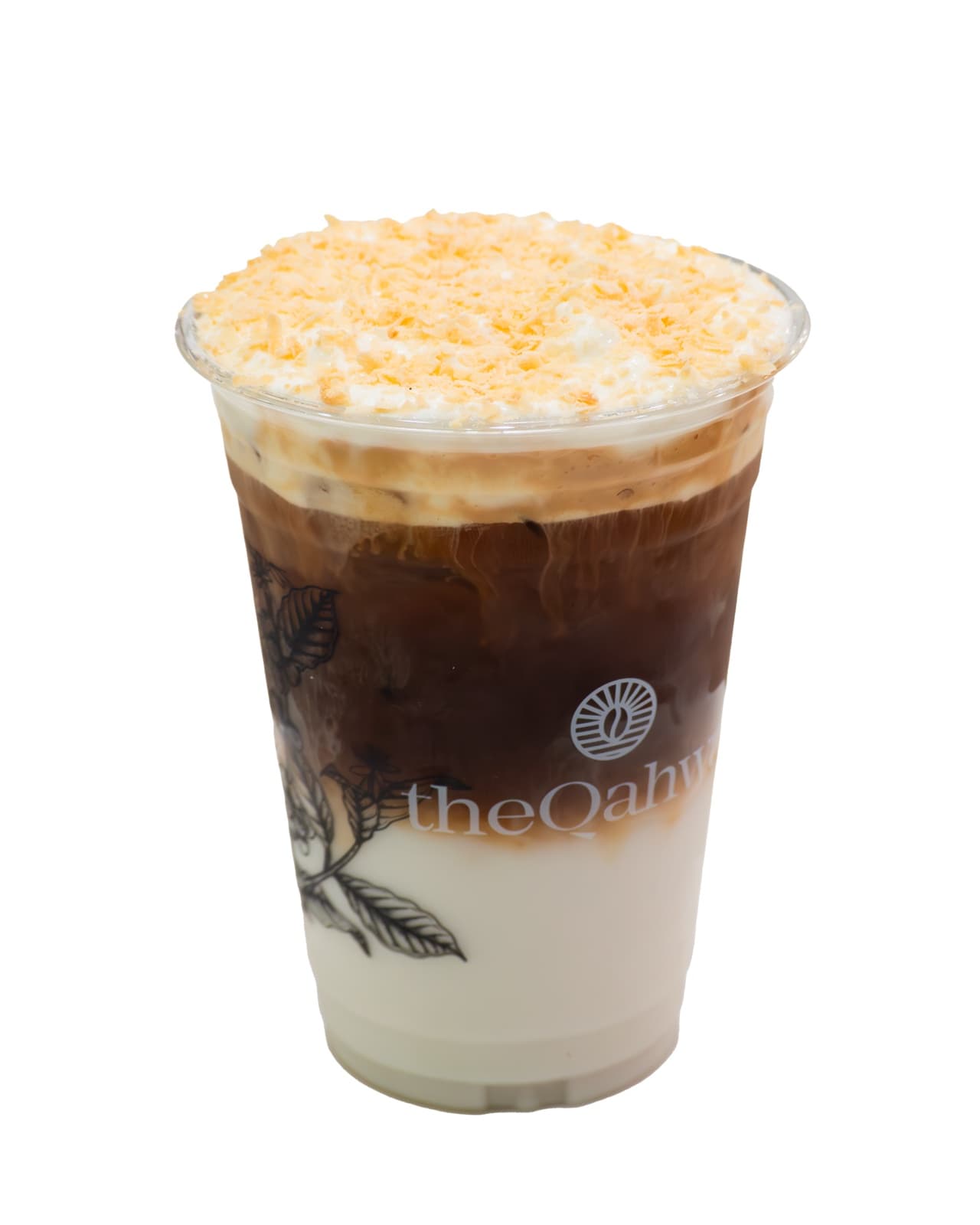 Iced Coconut Latte in a clear theQahwa cup — espresso and milk over ice, topped with whipped cream and a generous coconut crumble.